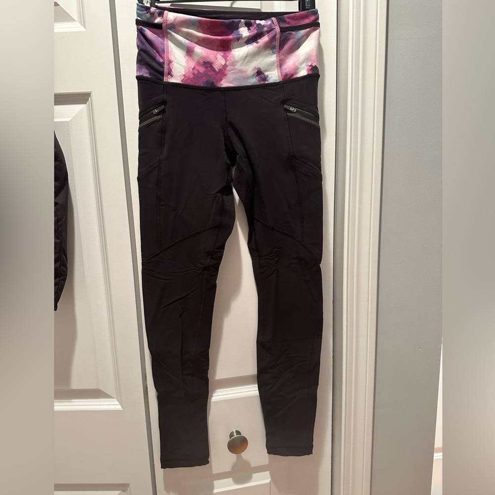Lululemon black runner legging - size 4, with zipper side pockets on each side.